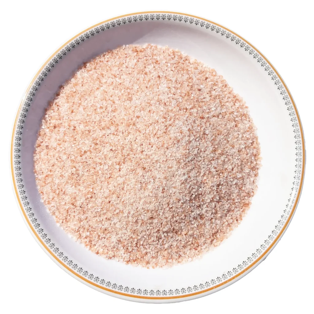 Himalayan Pink Salt Fine Grain - Pure Culinary Rock Salt Fine grain Himalayan pink salt crystals neatly displayed in a round white decorative ceramic plate
