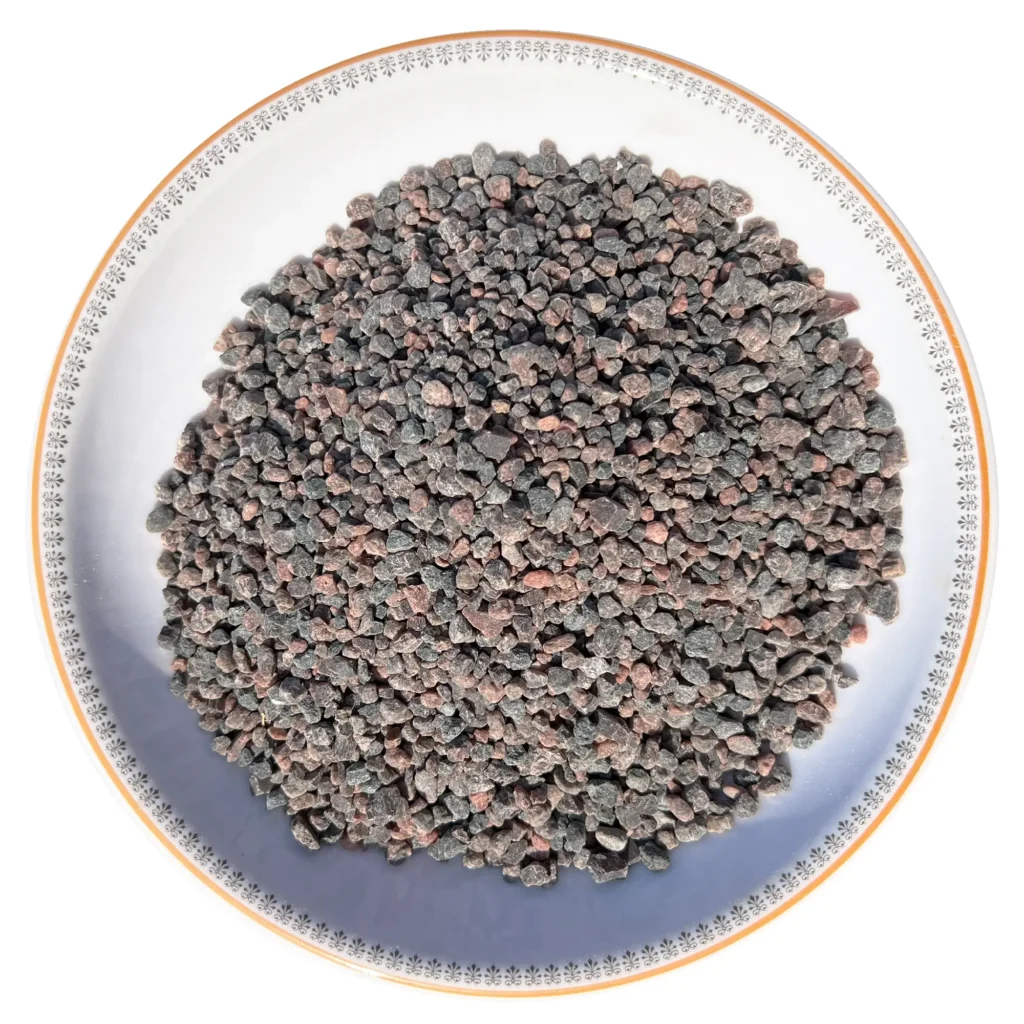 Himalayan Dark Pink Rock Salt - Coarse Grain Coarse grain Himalayan dark pink rock salt crystals neatly displayed in a round decorative ceramic plate