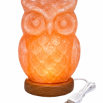 Illuminated handcrafted owl Himalayan pink salt lamp on a round wooden base with a white USB cable