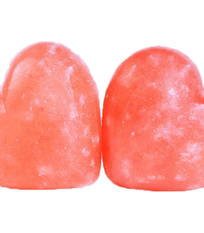 Two handcrafted heart-shaped Himalayan Pink Salt Massage Stones carved from pure natural rock salt crystal