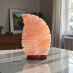 Handcrafted leaf shape table USB lamp with carved diagonal foliage grooves mounted on a circular dark wooden base