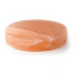 Handcrafted smooth round Himalayan Pink Salt Massage Stone disc carved from pure natural rock salt crystal