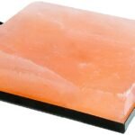 Handcrafted rectangular Himalayan Pink Salt Cooking Block resting inside a black metal serving frame with handles