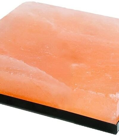 Handcrafted rectangular Himalayan Pink Salt Cooking Block resting inside a black metal serving frame with handles