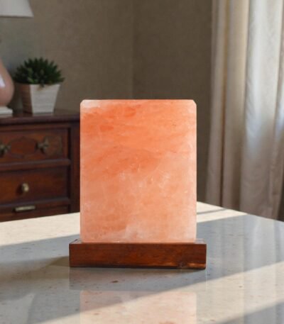 Handcrafted illuminated square table USB lamp carved from Himalayan pink salt mounted on a square dark wooden base