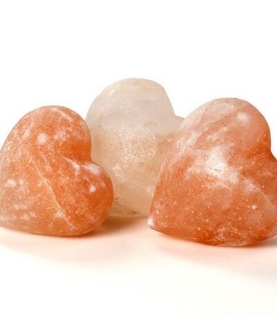 Handcrafted smooth heart-shaped Himalayan pink salt massage stone carved from pure rock salt crystal.