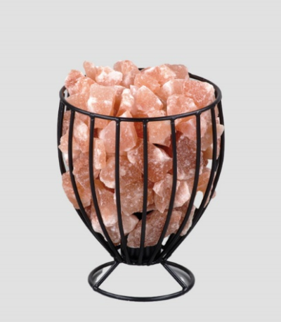 Handcrafted black wire goblet basket on pedestal base filled with raw Himalayan pink salt crystal chunks.