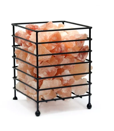 Handcrafted square matte black metal wire basket on ball feet filled with raw Himalayan pink salt crystal chunks.