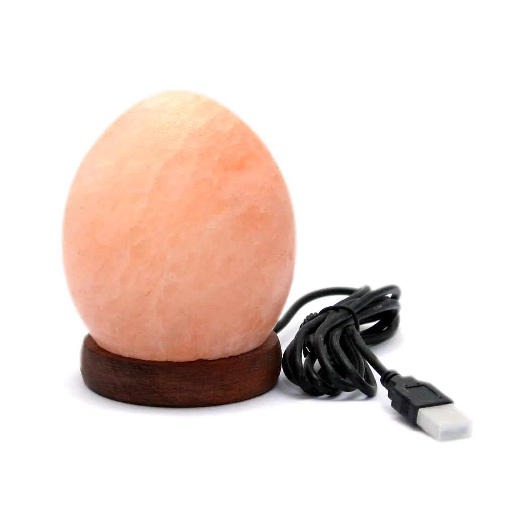 Handcrafted USB Egg Shaped Himalayan Pink Salt Lamp - Desktop Wellness Decor Handcrafted USB egg shaped Himalayan pink salt lamp with smooth ovoid contours mounted on a dark wooden base.