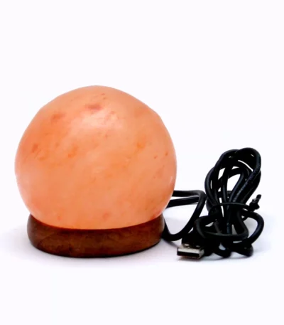 Handcrafted round USB globe shaped Himalayan pink salt lamp with wooden base and attached black USB power cable.