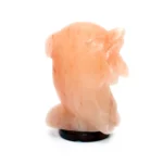 Handcrafted USB dolphin shaped Himalayan pink salt lamp with carved fin details mounted on a dark circular wooden base.
