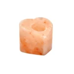 Handcrafted heart-shaped Himalayan pink salt tealight candle holder carved from natural rock salt crystal.