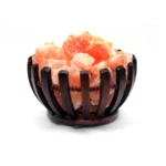 Handcrafted flared dark wooden bowl with beaded trim filled with raw Himalayan pink salt crystal chunks.
