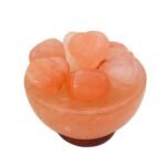 Handcrafted pink salt bowl with heart shape balls and polished dark wooden base filled with smooth pink salt heart stones