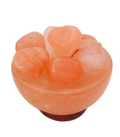 Handcrafted pink salt bowl with heart shape balls and polished dark wooden base filled with smooth pink salt heart stones