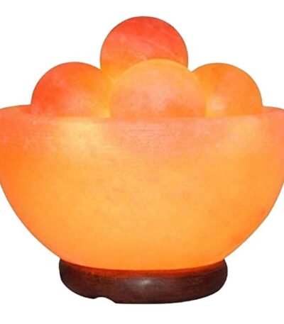 Handcrafted pink salt bowl with round balls and polished wooden base filled with smooth salt massage spheres