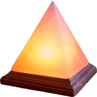 Handcrafted illuminated geometric pyramid Himalayan pink salt lamp mounted on a dark wooden base.