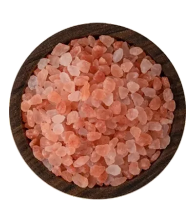 Coarse granules of pure Himalayan pink salt displayed neatly in a decorative bowl