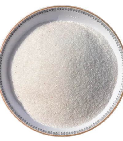 Fine grain Himalayan white salt crystals neatly displayed in a round white decorative ceramic plate